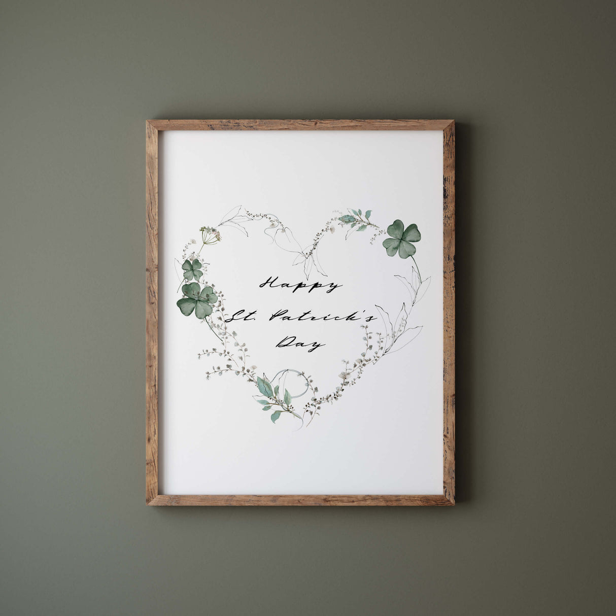 Happy St. Patrick's Day print with sage green clover and botanical heart wreath for St. Patrick home decor.