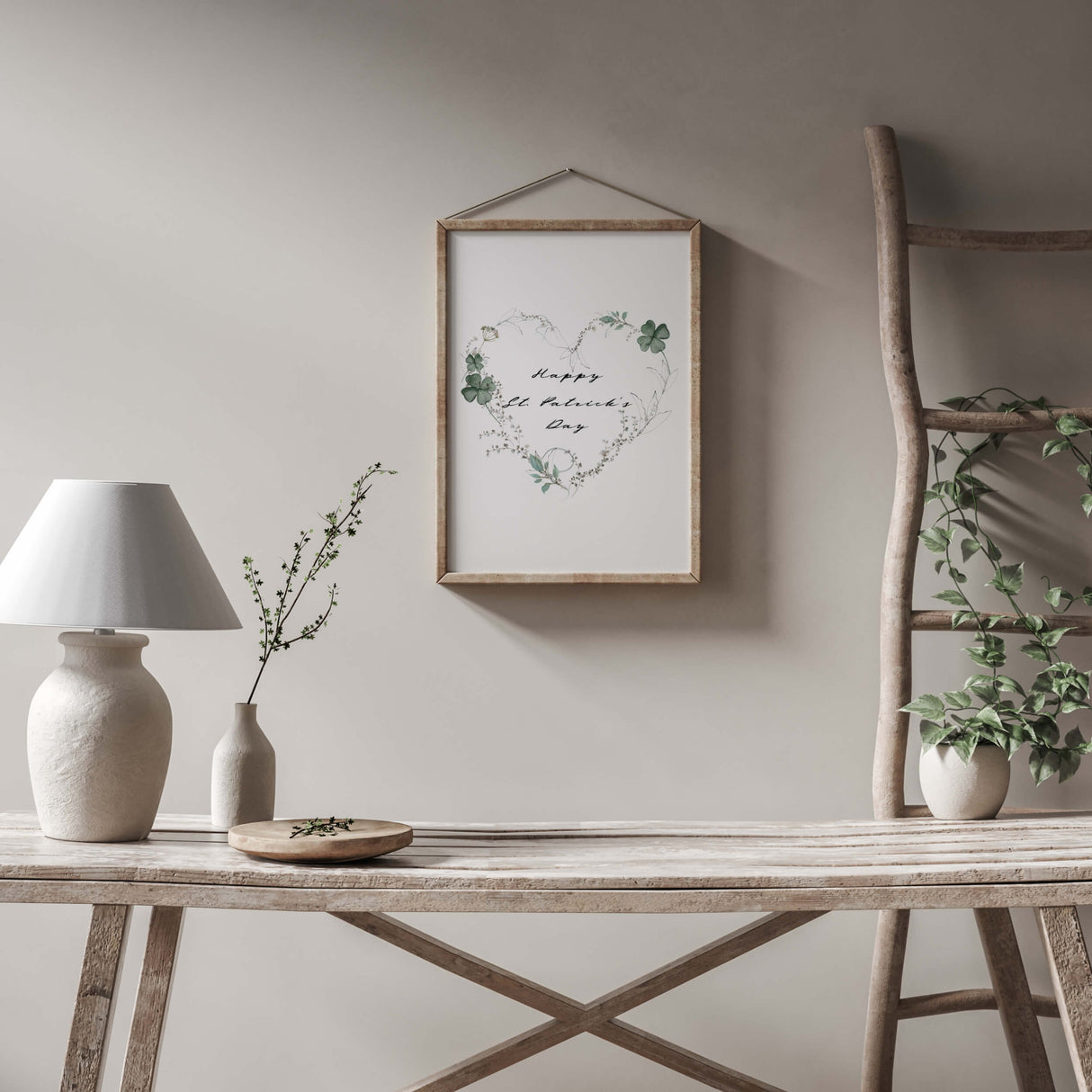 Happy St. Patrick's Day poster with sage green clover and botanical heart wreath for minimal St. Patrick home decor.