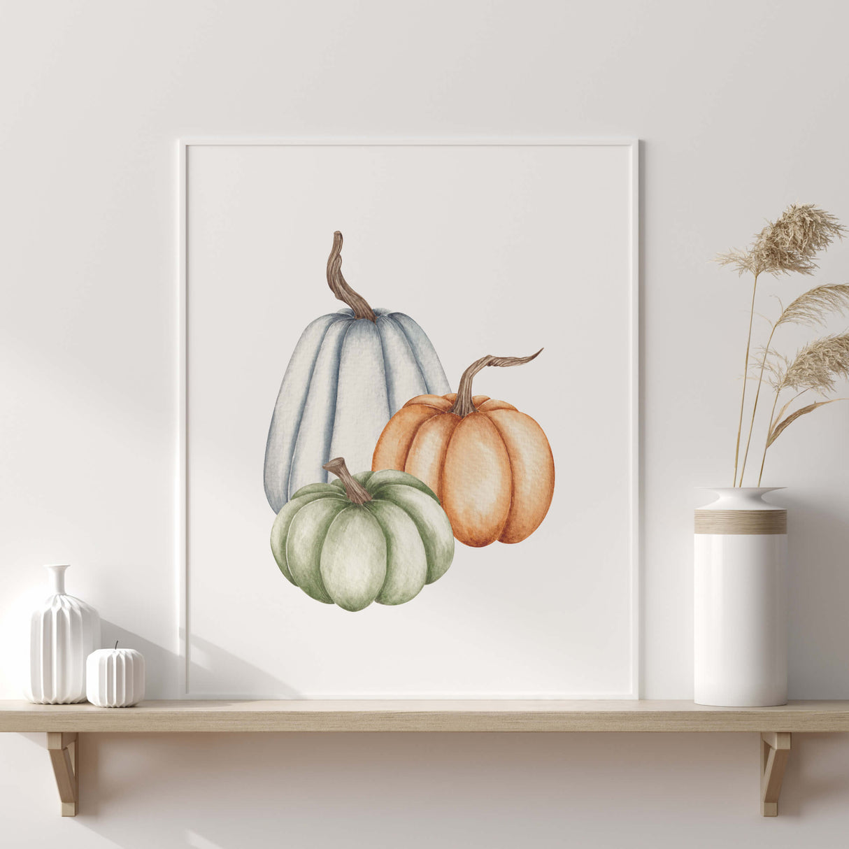 Watercolor pumpkin printable in blue, green, orange colors for boho fall decor.