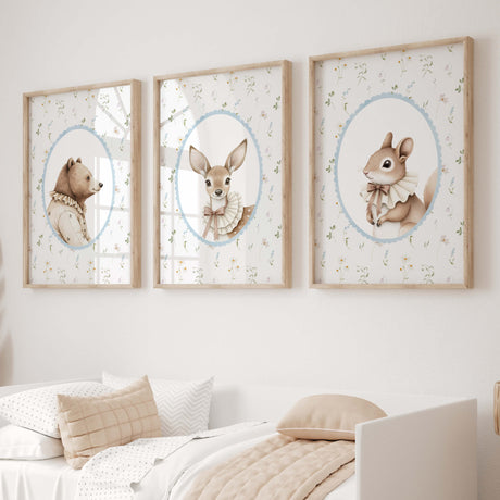 Set of three woodland animal nursery prints featuring a bear, deer, and squirrel with a wildflower background, perfect for baby room decor or nursery wall art