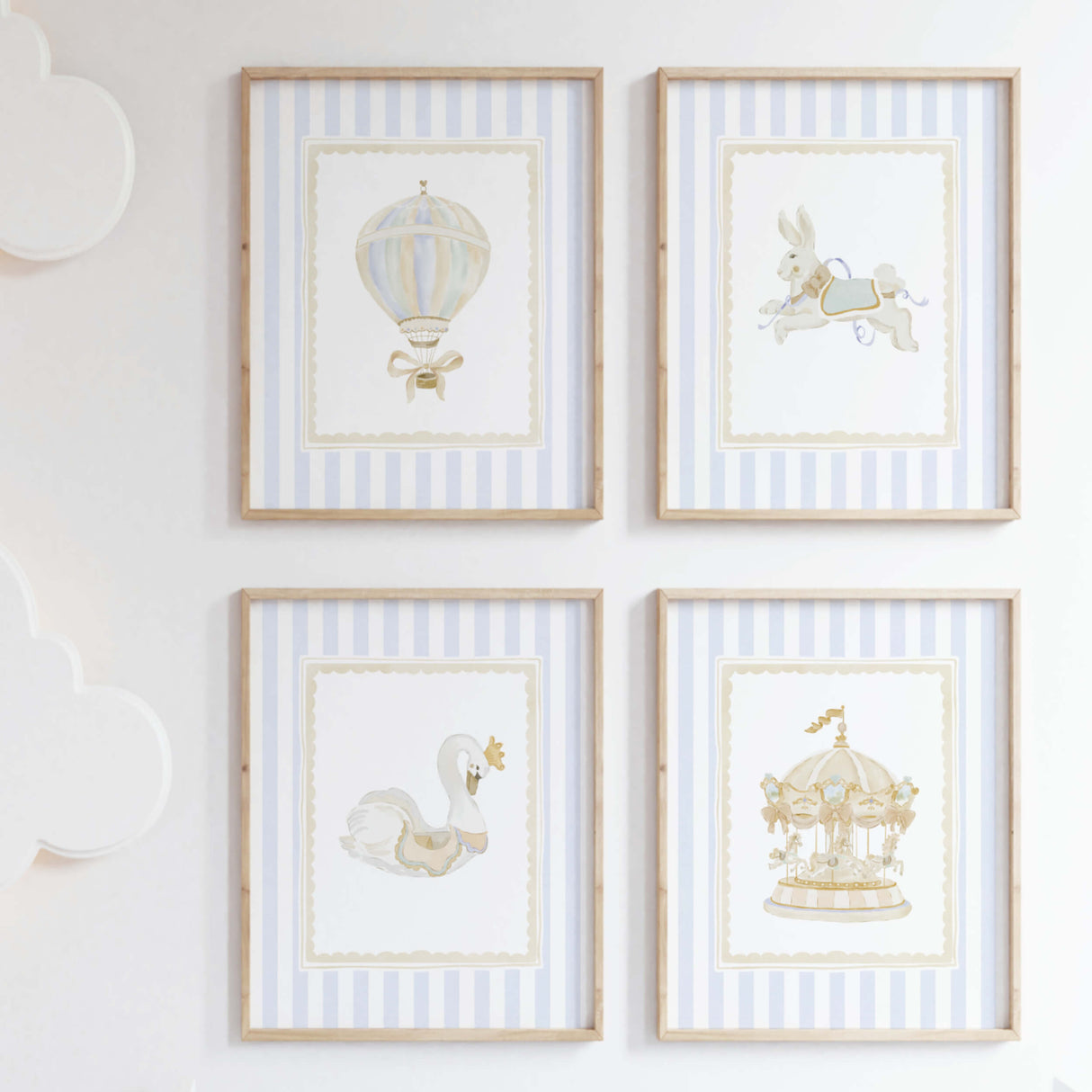 Blue striped nursery wall gallery featuring carousel animals hot air balloon ballerina and initial letters