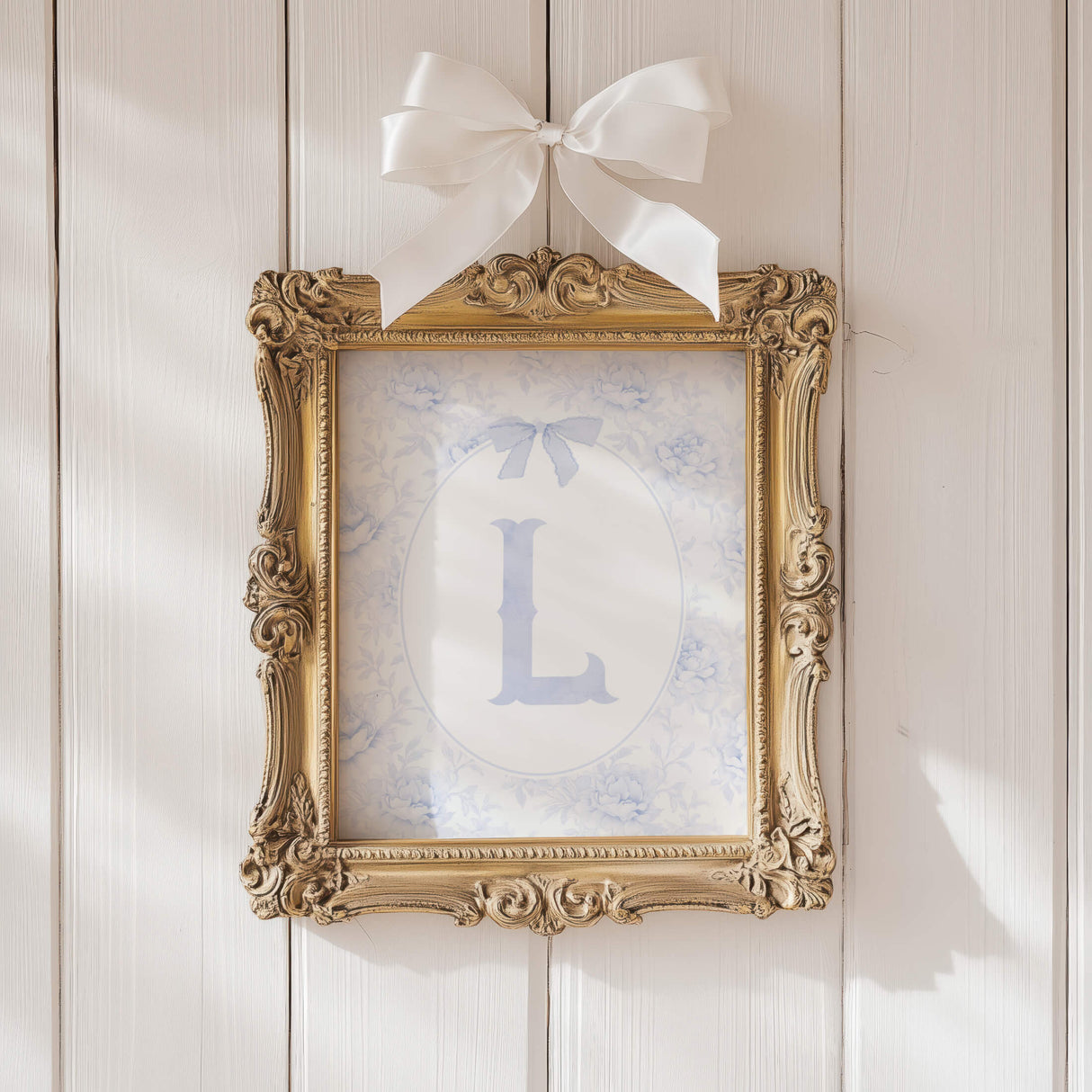 Blue floral nursery wall art with alphabet initial letters and classic bows