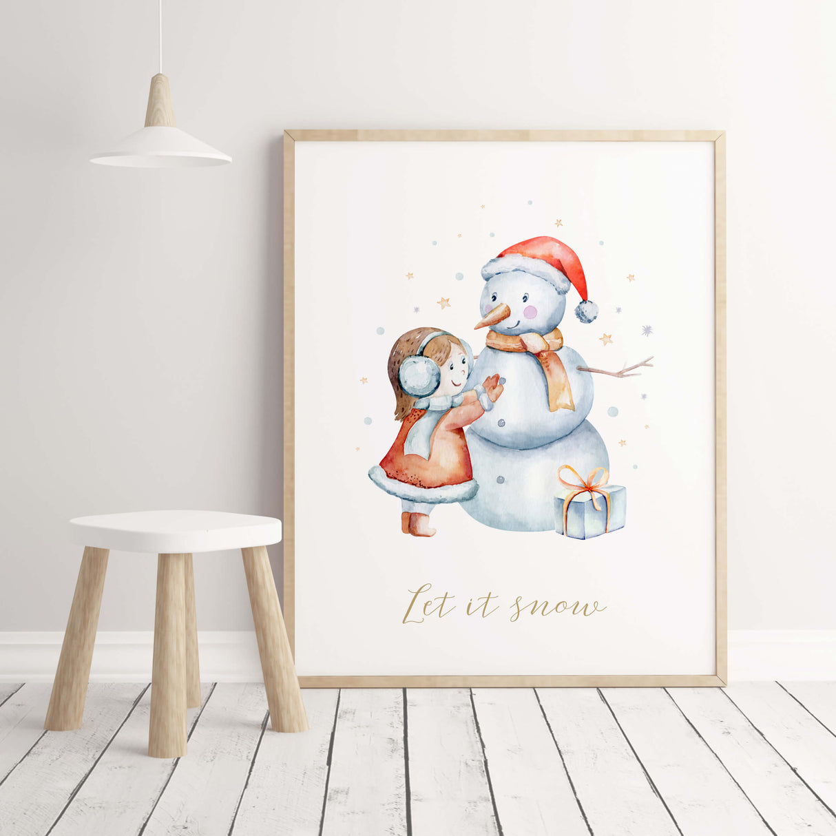 A little girl is building a snowman print for winter nursery decor.