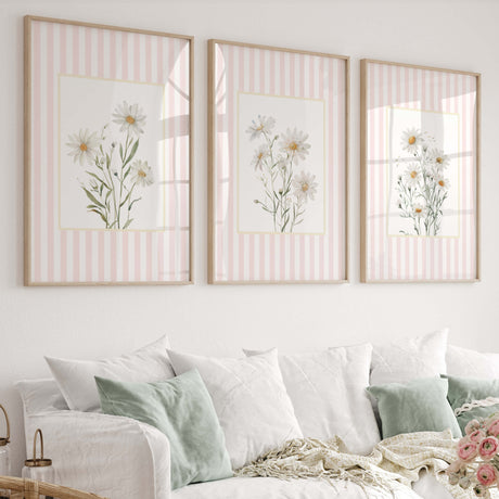 Cottagecore daisy wall prints with soft pink stripes for feminine interiors.