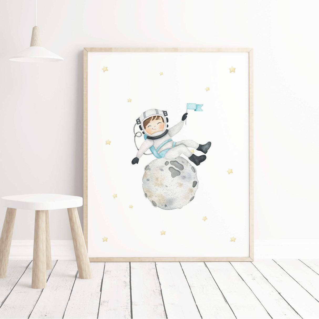 Watercolor astronaut boy with brown hair on the moon printable for boys nursery wall decor.