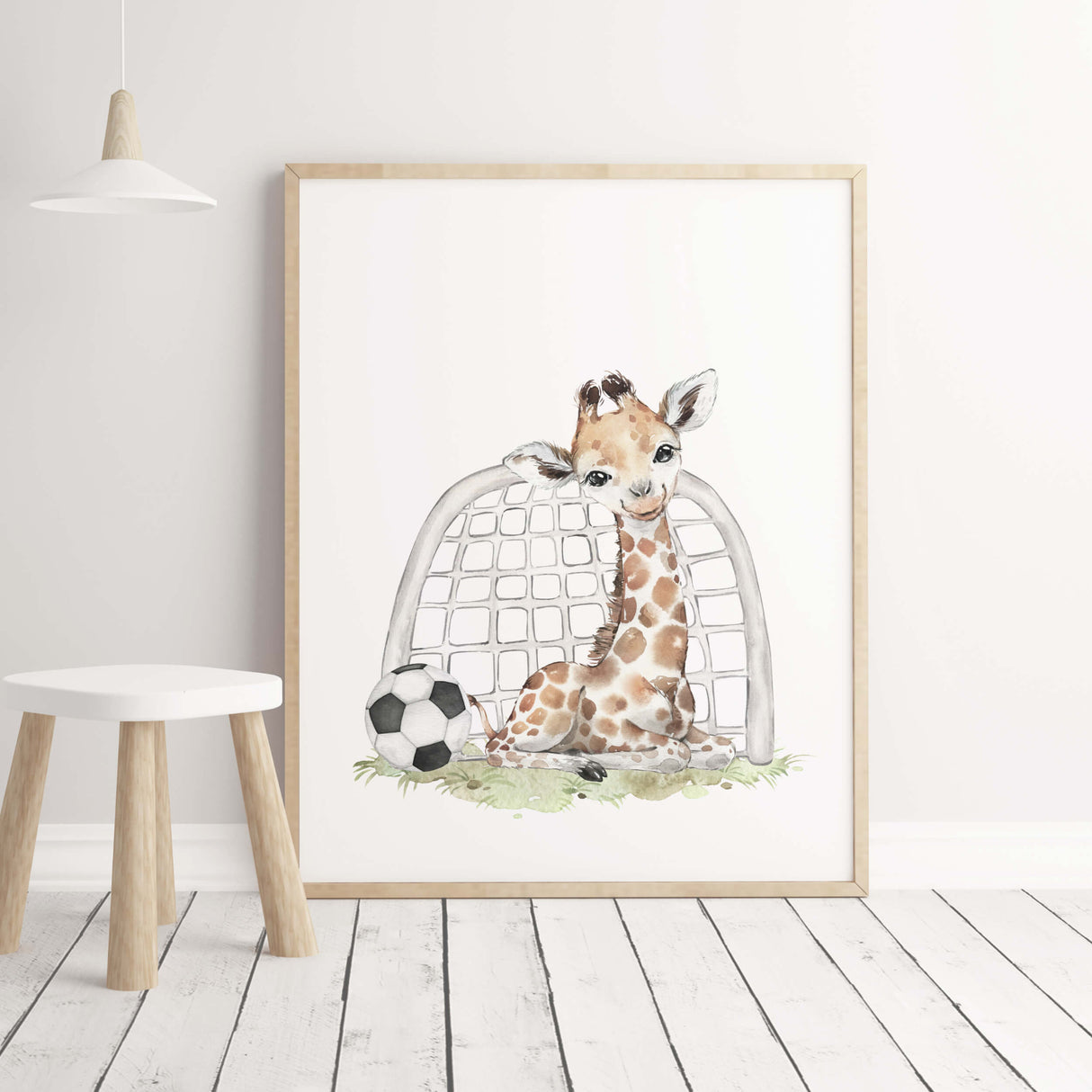 Watercolor giraffe print with football for boys room decor.