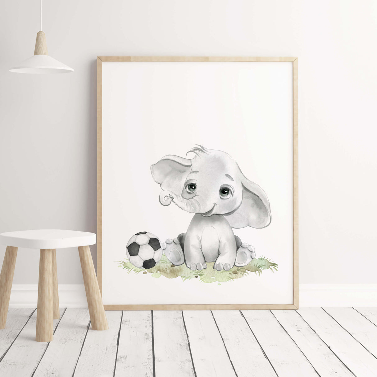 Watercolor elephant print with football for toddler room decor.