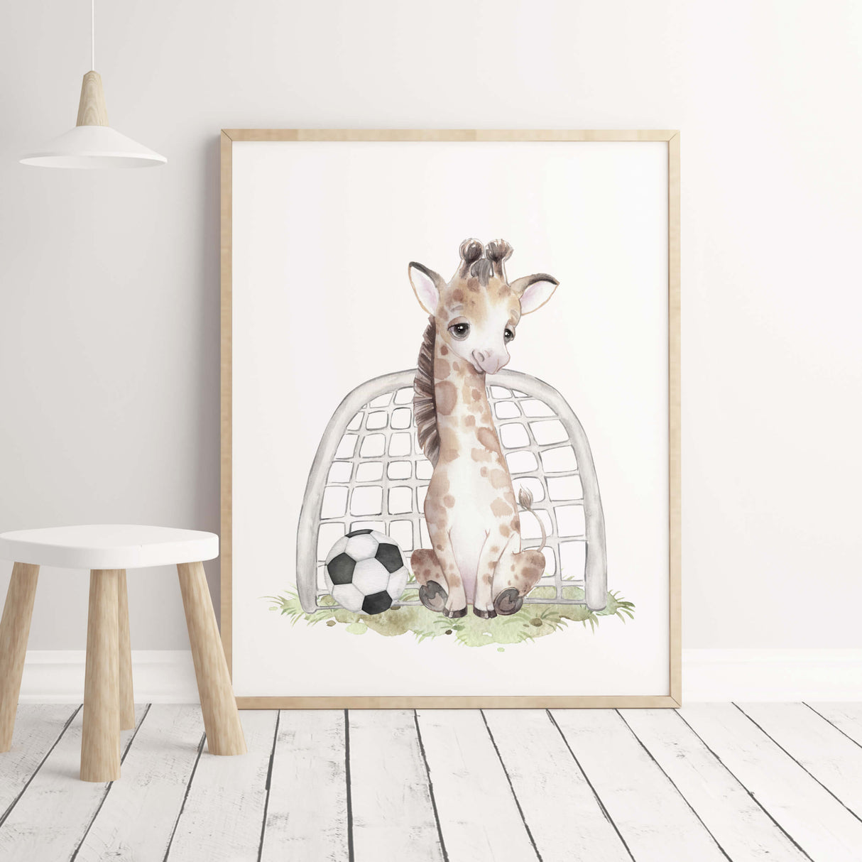 Watercolor giraffe print with football for boys room decor.