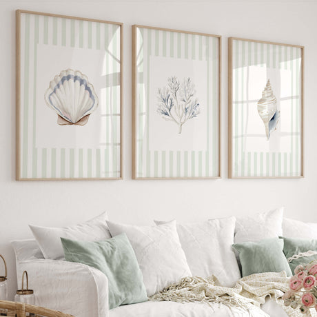 Coastal seashell and coral printable wall art set of 4 in navy and beige tones.