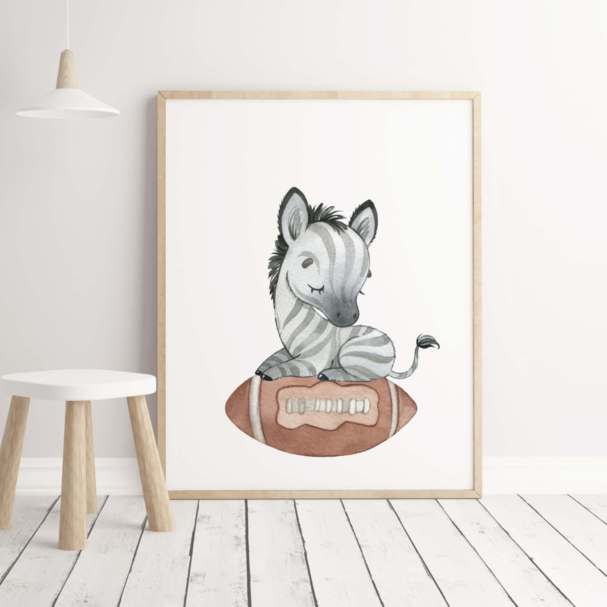Watercolor zebra with football nursery printable for toddler room decor.