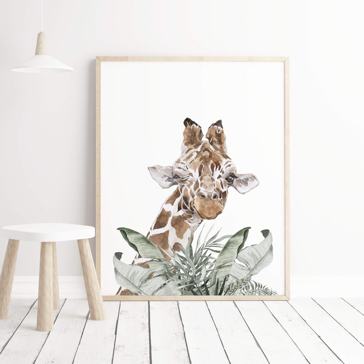 Watercolor giraffe print with leaves for neutral nursery room decor.