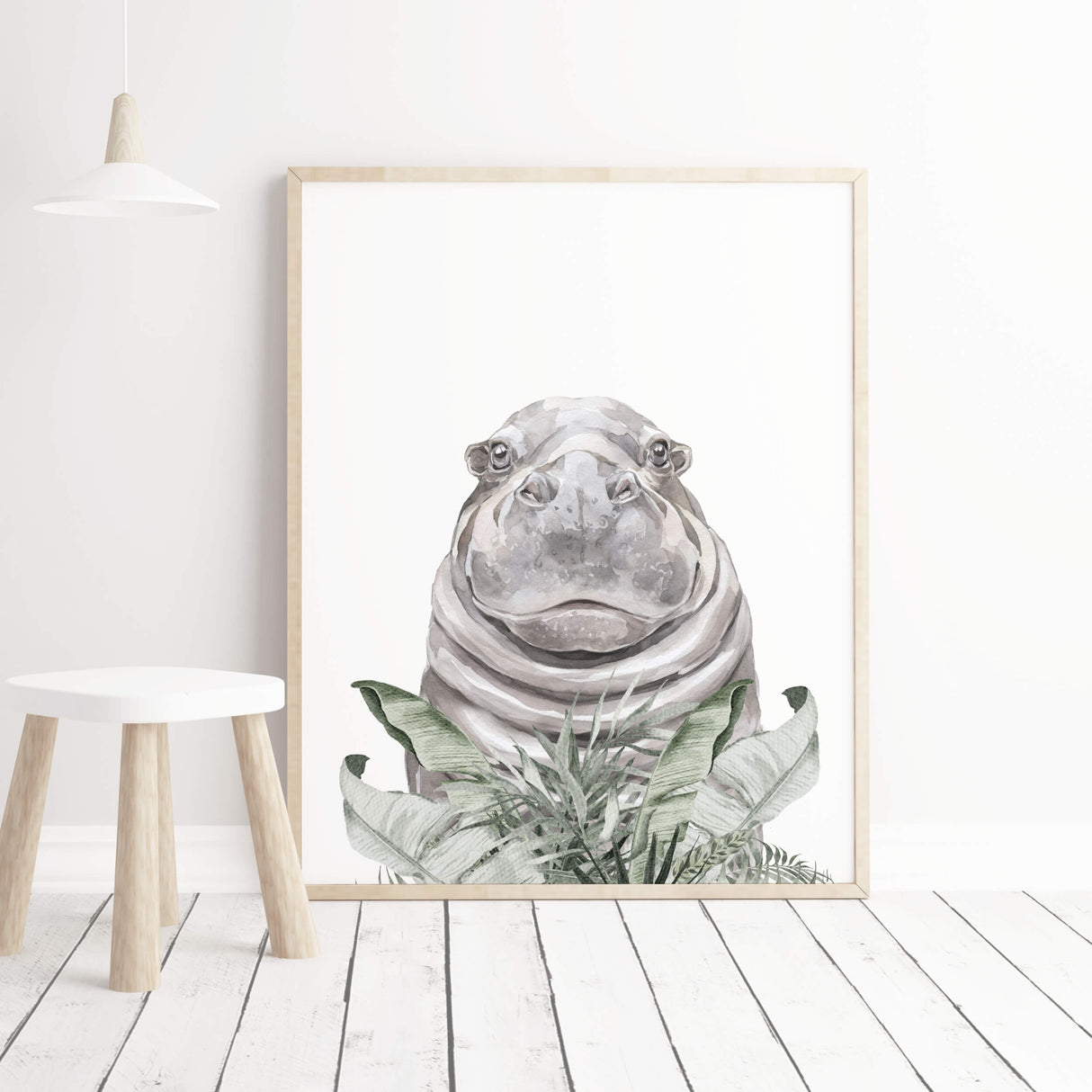 Watercolor hippo print with leaves for neutral nursery decor.