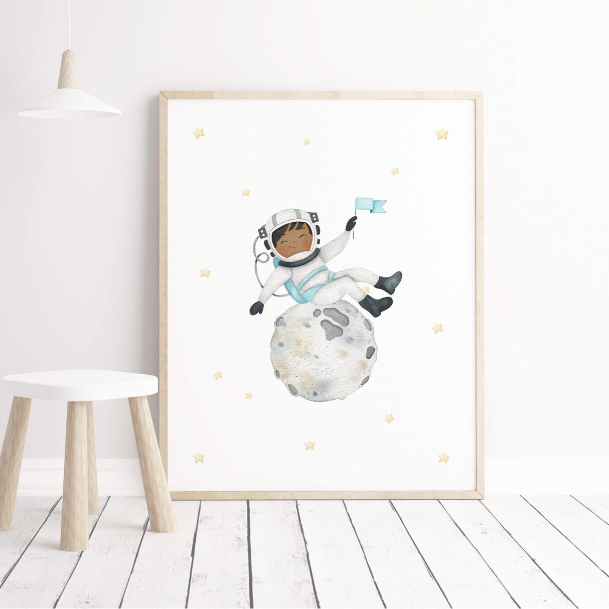 Watercolor astronaut boy with brown skin on the moon printable for boys nursery wall decor.