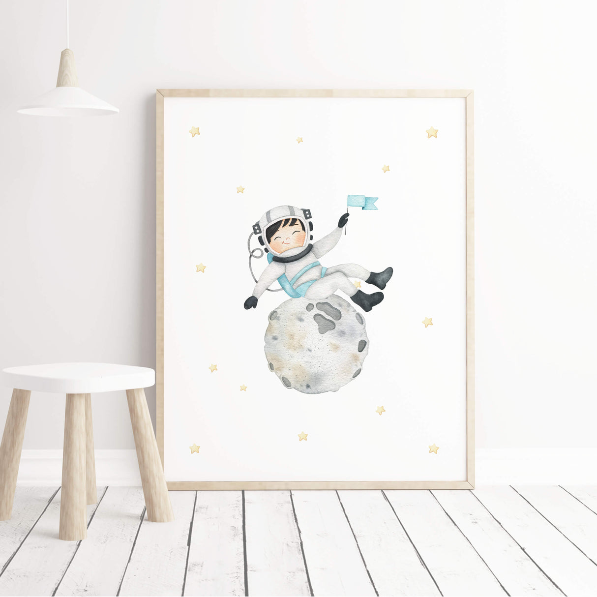 Watercolor astronaut boy with black hair on the moon printable for boys nursery wall decor.