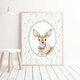 Printable deer portrait for a woodland nursery, accented with wildflowers and a soft sage green border.
