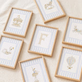 blue beige gender neutral nursery art bundle featuring circus carousel animals and customizable initial prints