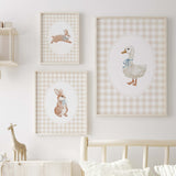 Set of three watercolor baby animal nursery prints: bunny with scarf, bunny with bow, goose with bib on a gingham background.
