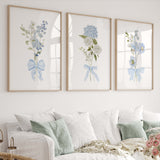 blue floral wall art set of four printable flower prints with blue bow for nursery or home decor
