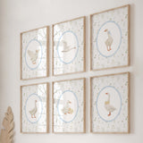 Boho nursery wall art set featuring vintage goose illustrations with wildflower backgrounds, perfect for baby room decor in neutral colors with blue accents