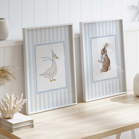 Scandinavian-style nursery wall art with watercolor bunny and goose prints.

