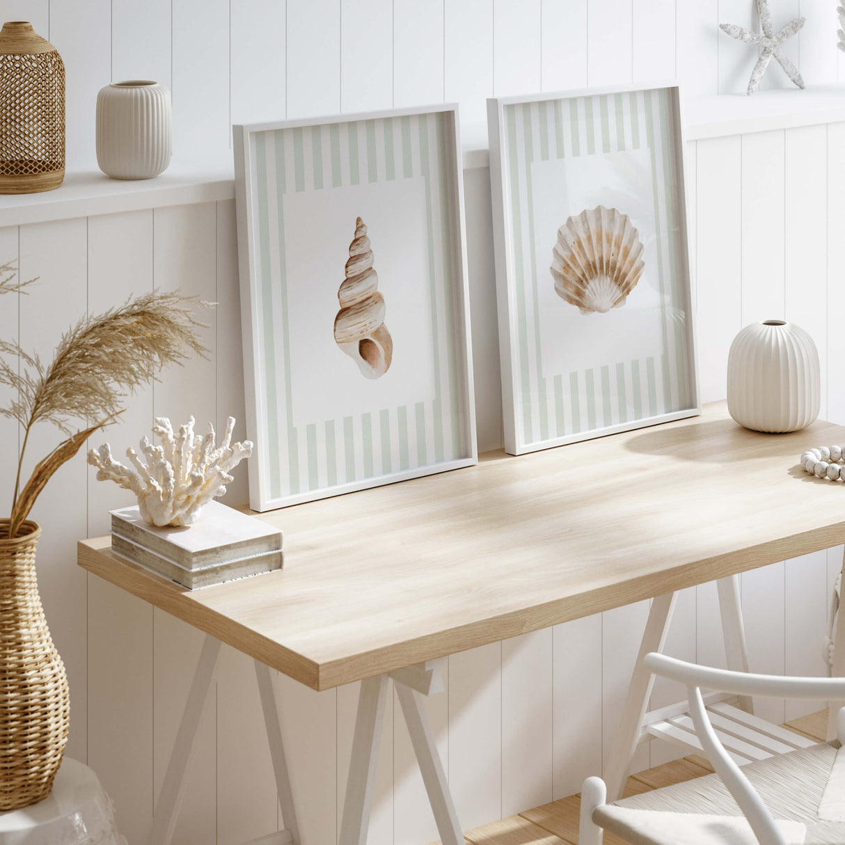 Coastal wall art featuring seashells and starfish in beige tones.