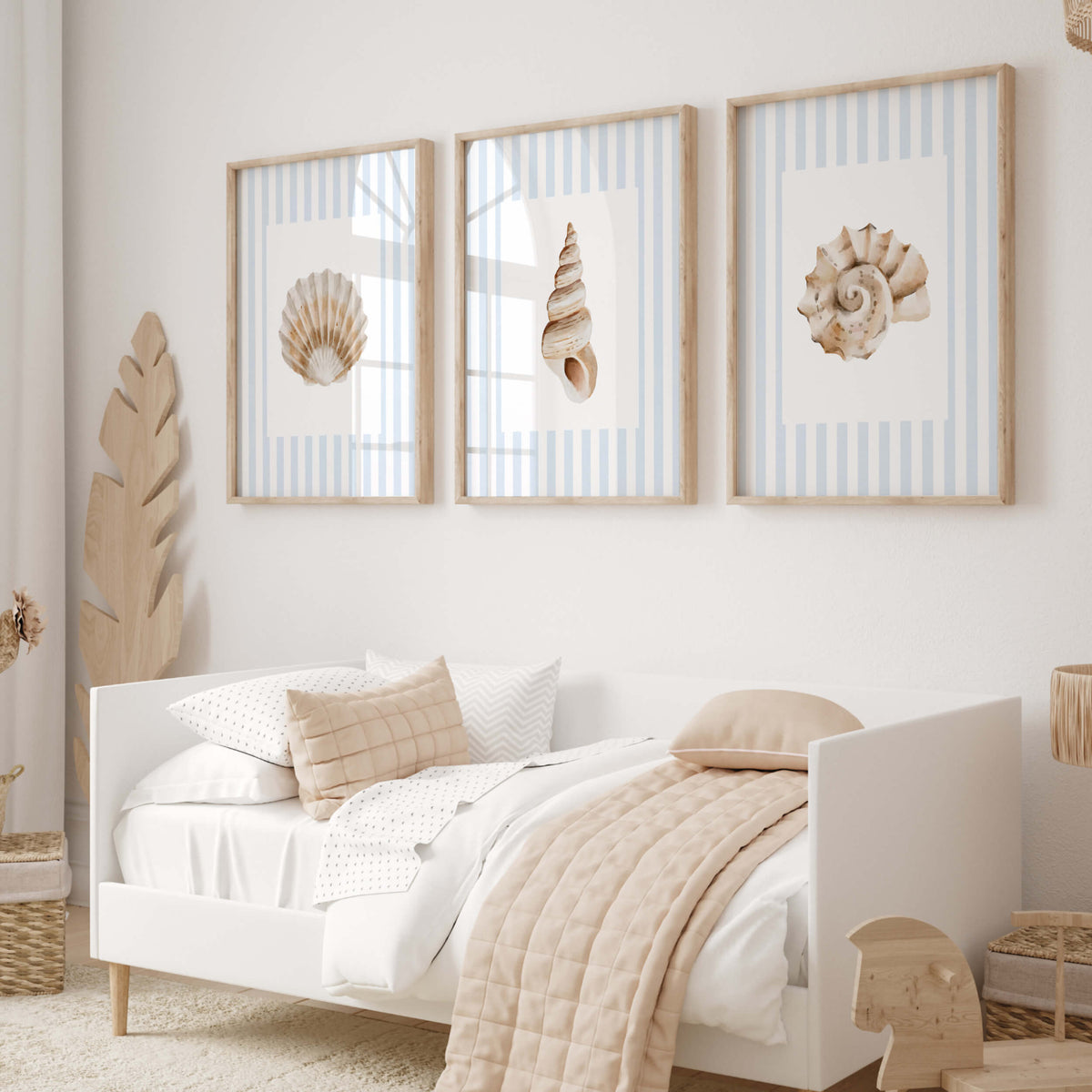 Light blue striped seashell wall art featuring watercolor shells and starfish for coastal nursery and kids room decor.