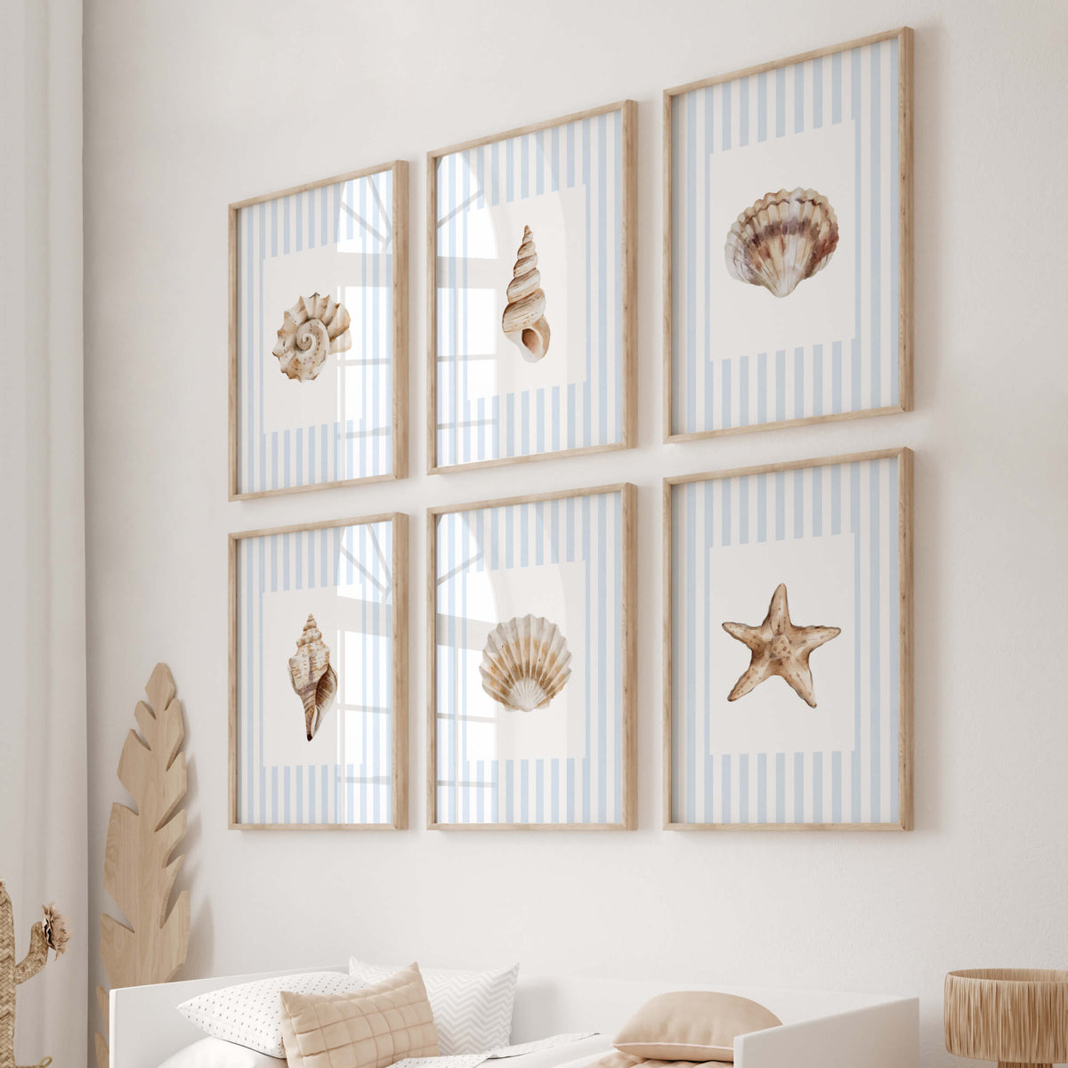 Set of six coastal wall art prints with seashells starfish and blue stripes for beach nursery bathroom and seaside home decor.