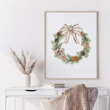Watercolor Christmas wreath printable wall art with pine greenery and beige ribbon.