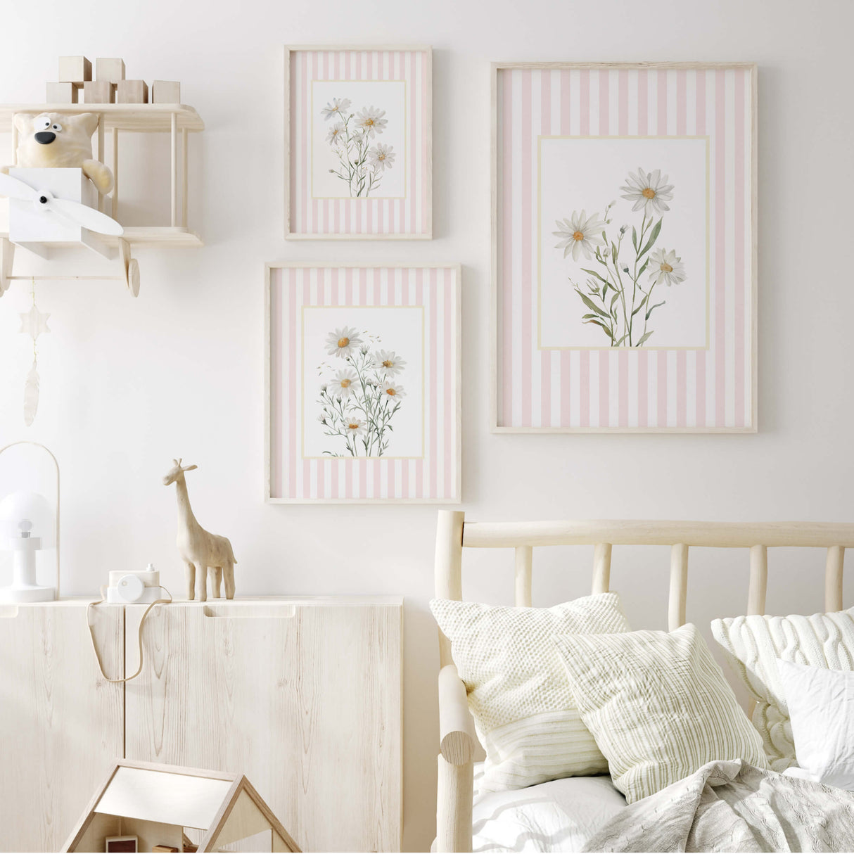 Botanical nursery decor in pastel pink and white with daisy flowers.

