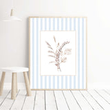 Botanical nursery wall prints with beige flowers and blue stripes


