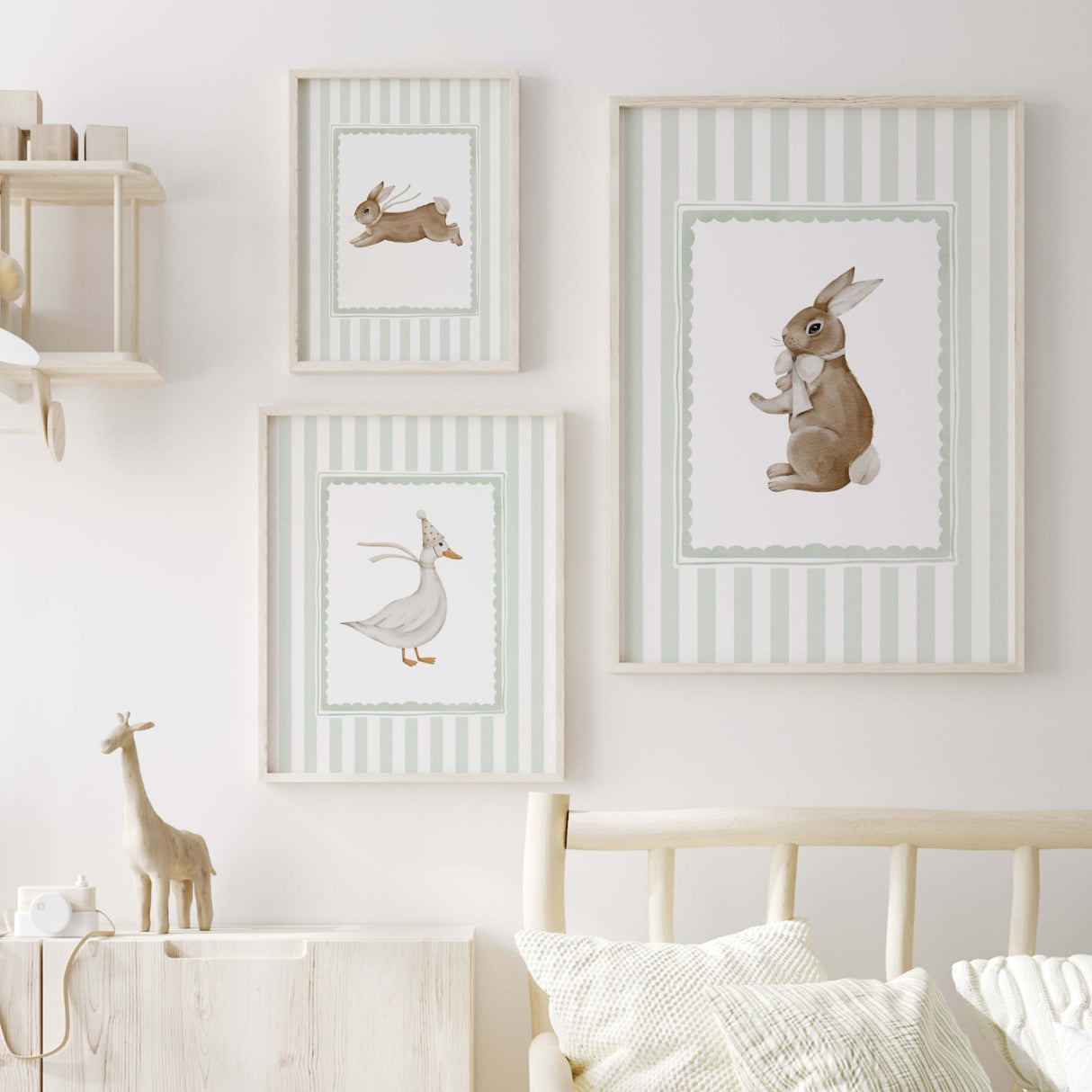 Scandinavian-style sage nursery wall decor with cute animals.

