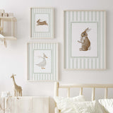 Scandinavian-style sage nursery wall decor with cute animals.

