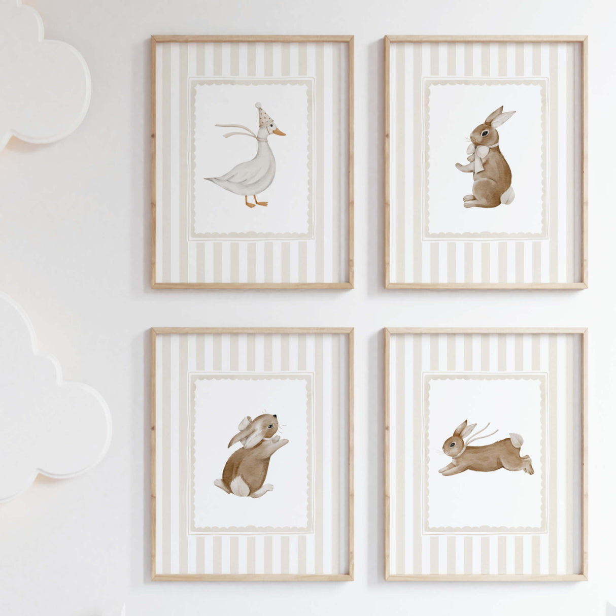 Beige nursery wall art with bunny and duck illustrations for neutral baby room.

