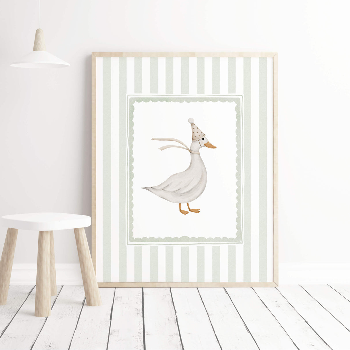Minimalist baby room decor with sage striped animal illustrations.


