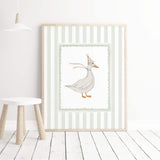 Minimalist baby room decor with sage striped animal illustrations.

