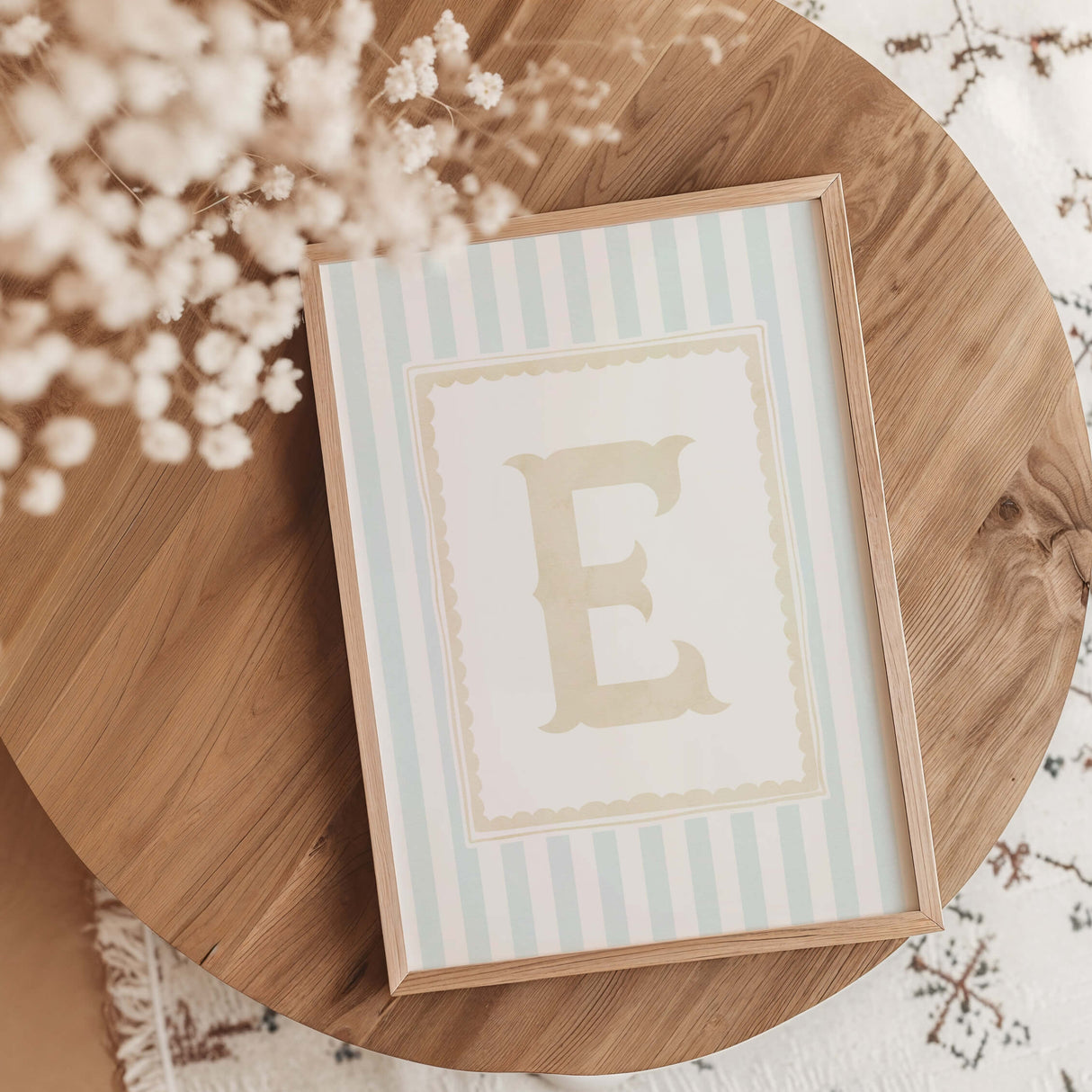 “A-Z alphabet initial nursery wall art printable set with pastel blue stripes and beige letters in wooden frames.”