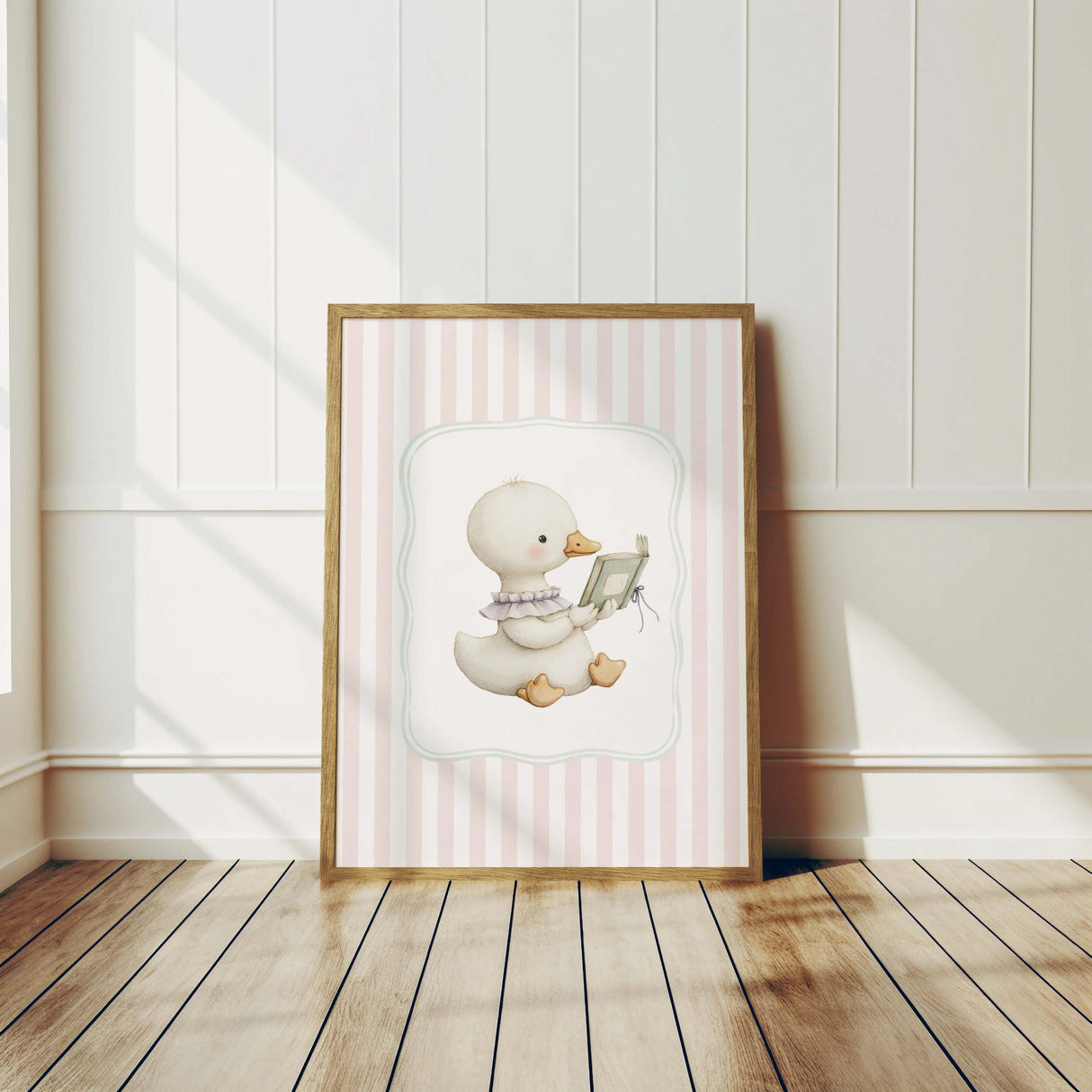 Nursery wall print of reading duckling on pastel pink stripes

