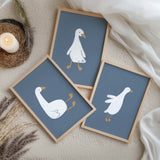 Minimalist cartoon goose posters on navy blue background

