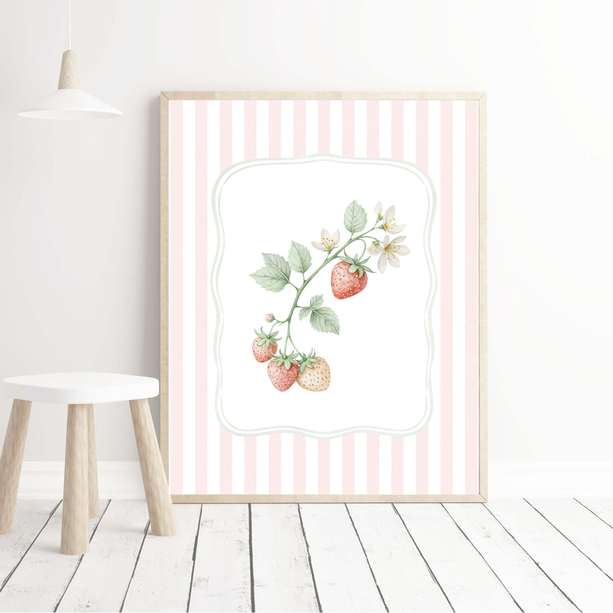 Pink kitchen wall art with pastel strawberry and mushroom illustrations in stripe background.

