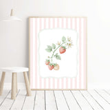 Pink kitchen wall art with pastel strawberry and mushroom illustrations in stripe background.

