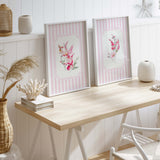 Watercolor pink floral wall art set with striped pastel background for feminine interior
