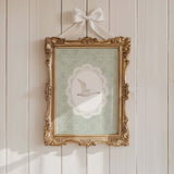 Standing goose nursery art print with lace border and green floral background
