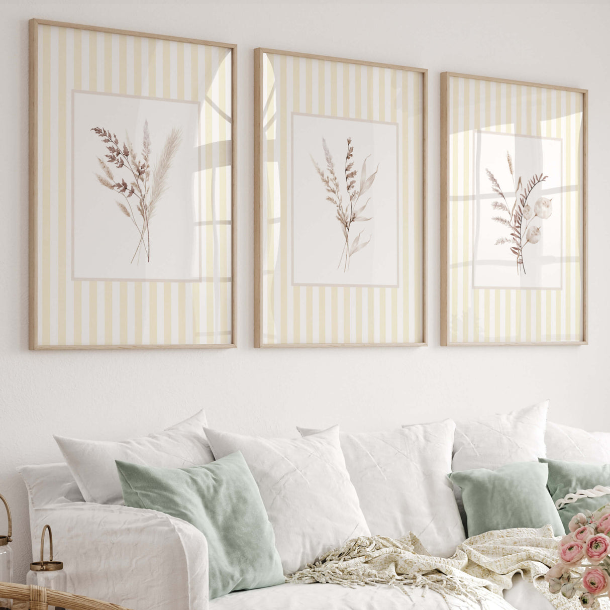Neutral botanical wall art set of 4 with beige dried florals on yellow striped background for nursery decor

